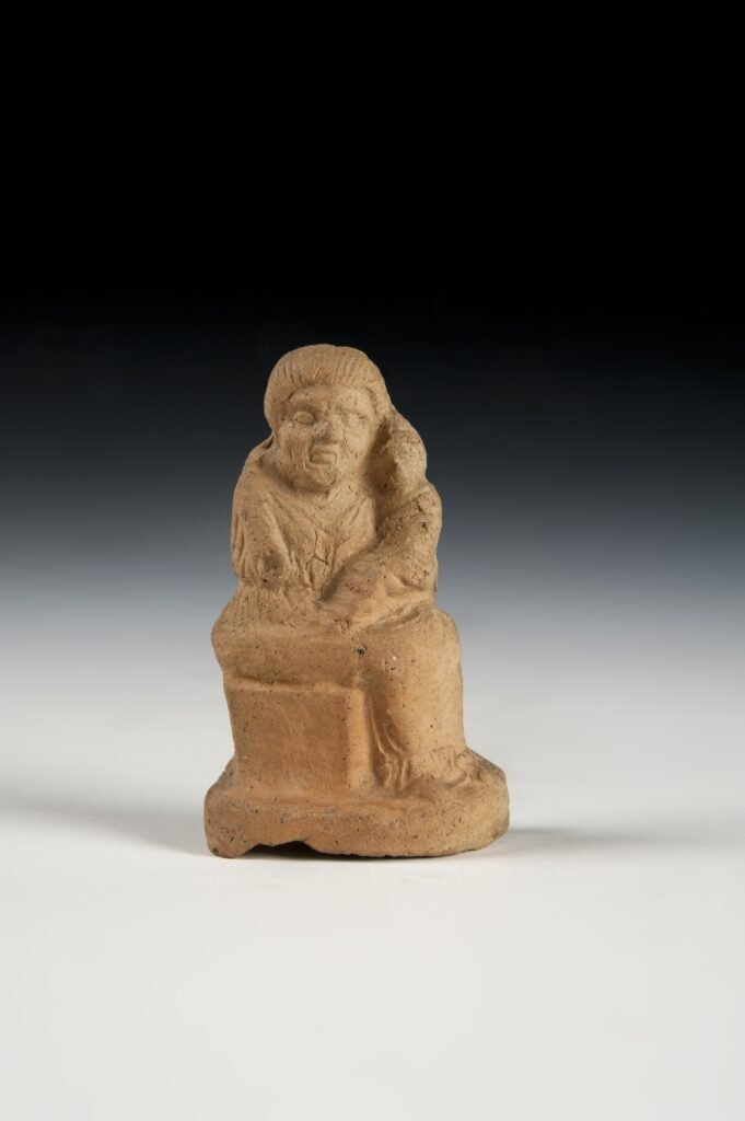 Nodriza. Terracota, Grecia continental, 300-200 a.C.